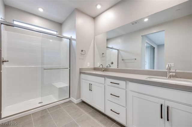 11922 Glide Reflection Ave, Las Vegas, NV 89138 - full bathroom featuring double vanity, a stall shower, tile patterned flooring, and recessed lighting