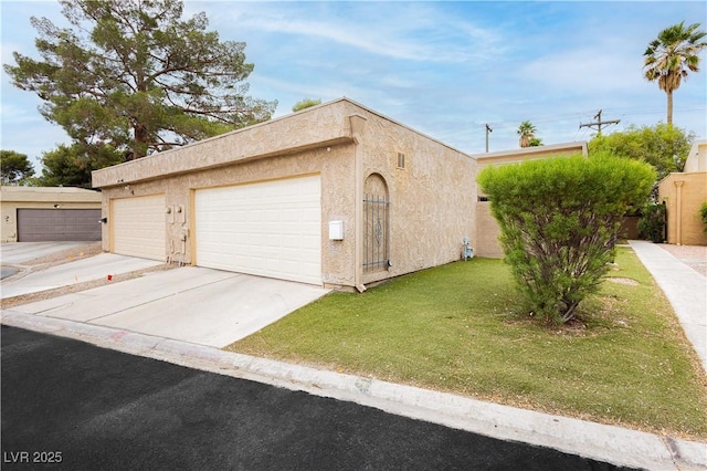 4232 Park Ct, Las Vegas, NV 89110 - view of front of home with stucco siding, a front yard, and concrete driveway