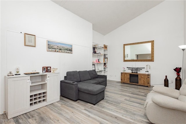 4232 Park Ct, Las Vegas, NV 89110 - living area with light wood-type flooring and high vaulted ceiling