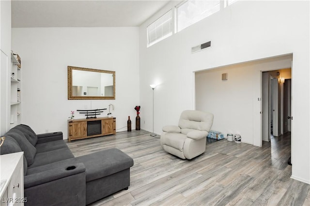 4232 Park Ct, Las Vegas, NV 89110 - living room with a high ceiling and light wood-type flooring