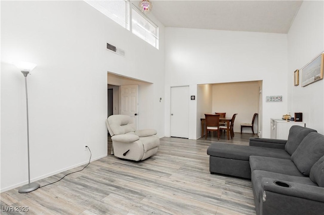 4232 Park Ct, Las Vegas, NV 89110 - living room with a high ceiling and light wood-style floors
