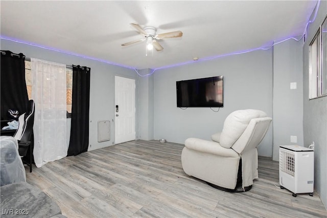4232 Park Ct, Las Vegas, NV 89110 - sitting room featuring a ceiling fan and light wood-style flooring