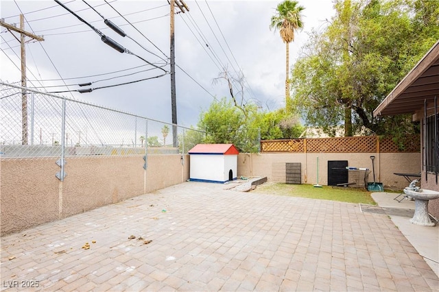 4232 Park Ct, Las Vegas, NV 89110 - fenced backyard with a storage unit and a patio