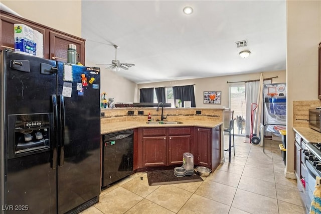 2716 Orchid Moon Ct, North Las Vegas, NV 89031 - kitchen featuring black appliances, a peninsula, light tile patterned floors, and a ceiling fan