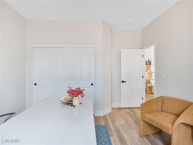 4314 Livorno Ave, Las Vegas, NV 89141 - living area featuring light wood-style flooring and baseboards