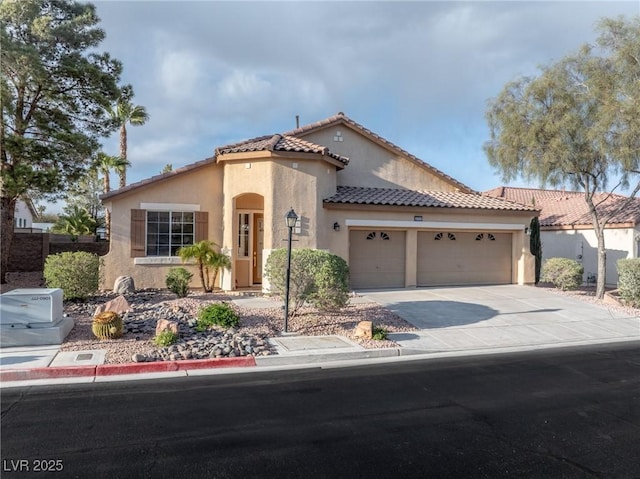 4314 Livorno Ave, Las Vegas, NV 89141 - mediterranean / spanish-style house featuring stucco siding, a tiled roof, a garage, and driveway