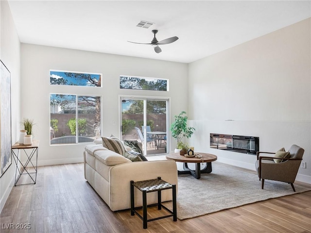 4314 Livorno Ave, Las Vegas, NV 89141 - living room featuring ceiling fan and wood finished floors