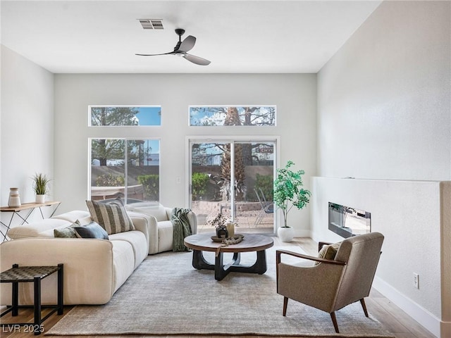 4314 Livorno Ave, Las Vegas, NV 89141 - living area with a ceiling fan and wood finished floors