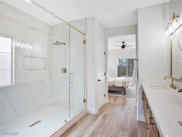 4314 Livorno Ave, Las Vegas, NV 89141 - ensuite bathroom featuring wood finished floors, a marble finish shower, double vanity, and a ceiling fan