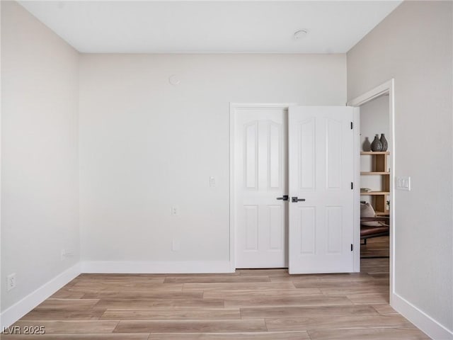 4314 Livorno Ave, Las Vegas, NV 89141 - unfurnished bedroom with light wood-style flooring and a closet