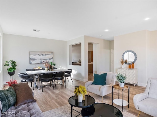 4314 Livorno Ave, Las Vegas, NV 89141 - living room with light wood-style floors and recessed lighting