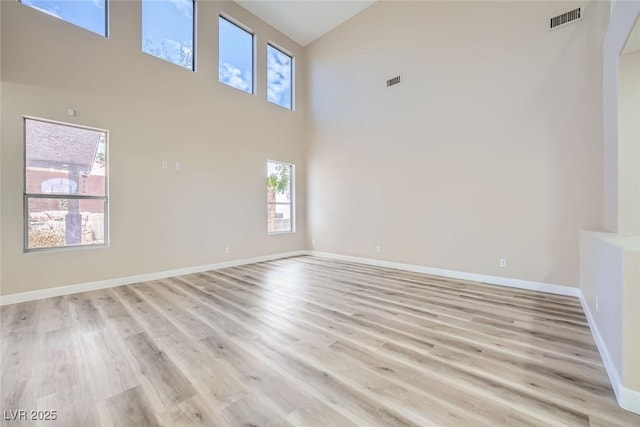 9272 W Viking Rd, Las Vegas, NV 89147 - spare room featuring high vaulted ceiling and light wood-style floors