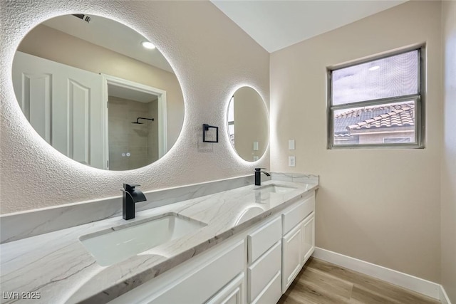 9272 W Viking Rd, Las Vegas, NV 89147 - full bath featuring double vanity and wood finished floors