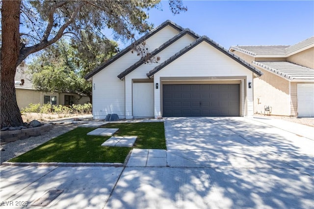 363 El Pico Dr, Henderson, NV 89014 - ranch-style house with concrete driveway, a garage, and a tiled roof