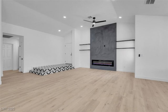 363 El Pico Dr, Henderson, NV 89014 - unfurnished living room with ceiling fan, light wood finished floors, lofted ceiling, recessed lighting, and a fireplace