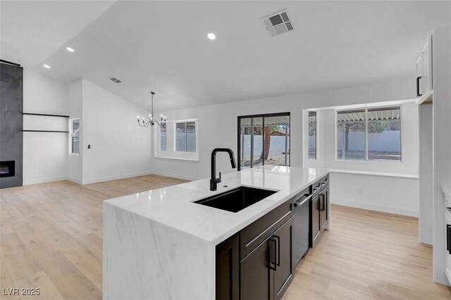 363 El Pico Dr, Henderson, NV 89014 - kitchen with a chandelier, light wood-style floors, light countertops, vaulted ceiling, and recessed lighting