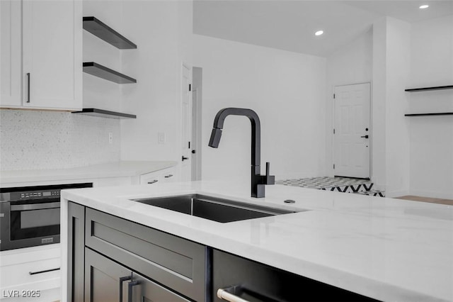 363 El Pico Dr, Henderson, NV 89014 - kitchen featuring open shelves, light countertops, tasteful backsplash, recessed lighting, and gray cabinetry