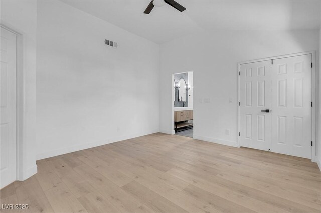 363 El Pico Dr, Henderson, NV 89014 - unfurnished bedroom featuring lofted ceiling, light wood finished floors, connected bathroom, ceiling fan, and a closet