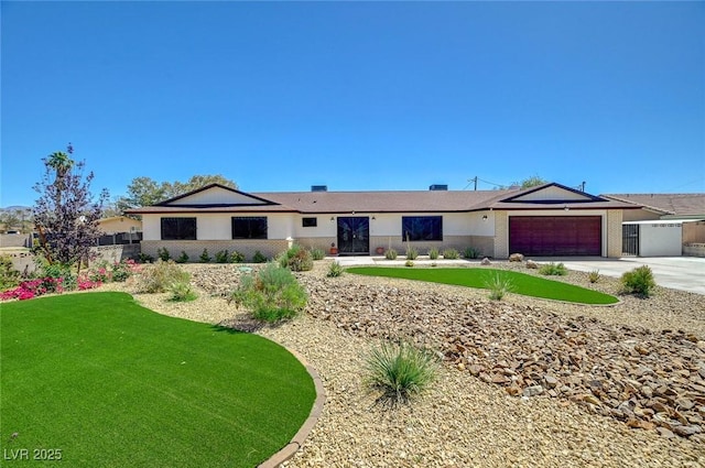 3917 Leon Ave, Las Vegas, NV 89130 - ranch-style home featuring driveway, a garage, and a front lawn