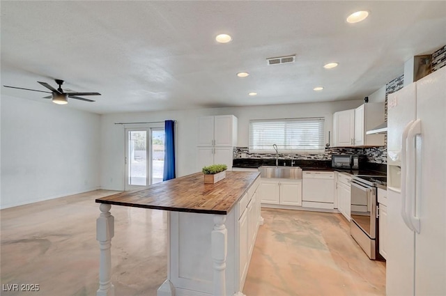 3917 Leon Ave, Las Vegas, NV 89130 - kitchen with white appliances, butcher block counters, healthy amount of natural light, backsplash, and recessed lighting
