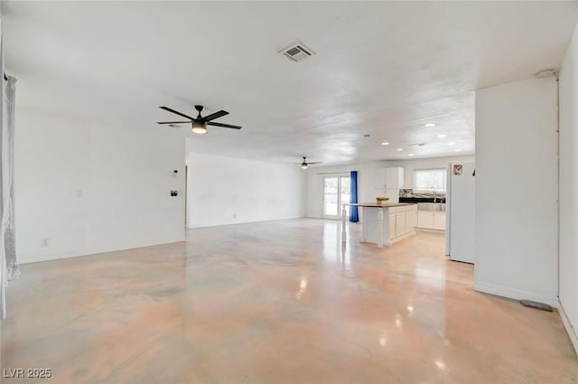 3917 Leon Ave, Las Vegas, NV 89130 - unfurnished living room with a ceiling fan, concrete flooring, and recessed lighting
