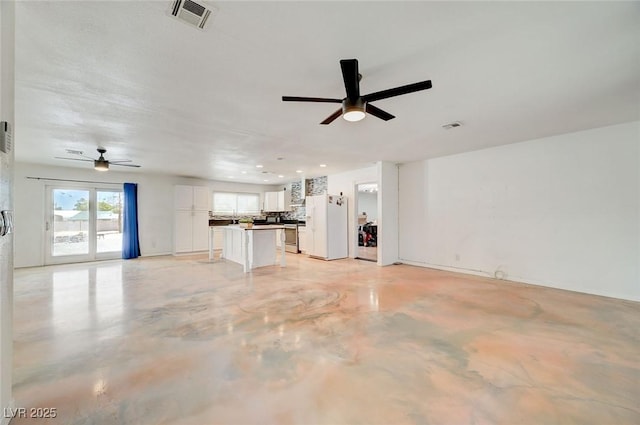 3917 Leon Ave, Las Vegas, NV 89130 - unfurnished living room featuring a ceiling fan and finished concrete floors