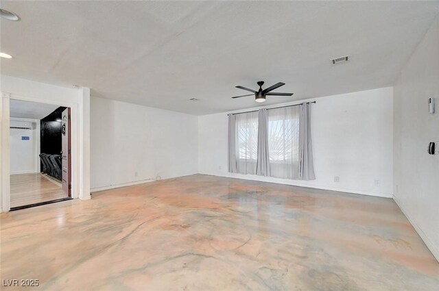 3917 Leon Ave, Las Vegas, NV 89130 - empty room with finished concrete flooring, a ceiling fan, and an AC wall unit