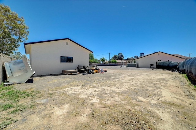 3917 Leon Ave, Las Vegas, NV 89130 - back of house featuring stucco siding