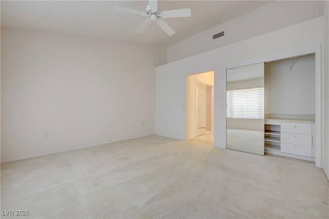 2808 Crown Ridge Dr, Las Vegas, NV 89134 - unfurnished bedroom with light carpet, a closet, ceiling fan, and connected bathroom
