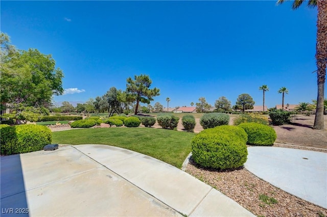 2808 Crown Ridge Dr, Las Vegas, NV 89134 - view of property's community with a lawn and a patio area