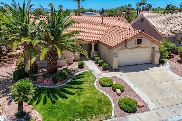 2808 Crown Ridge Dr, Las Vegas, NV 89134 - mediterranean / spanish-style house with stucco siding, a garage, a tiled roof, driveway, and a front lawn
