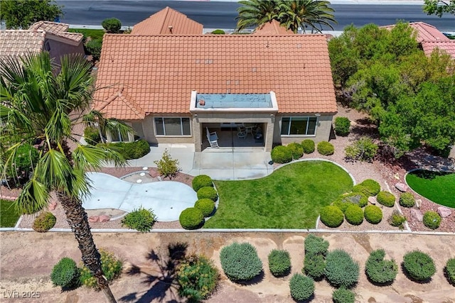 2808 Crown Ridge Dr, Las Vegas, NV 89134 - back of property with a tiled roof, stucco siding, and a lawn