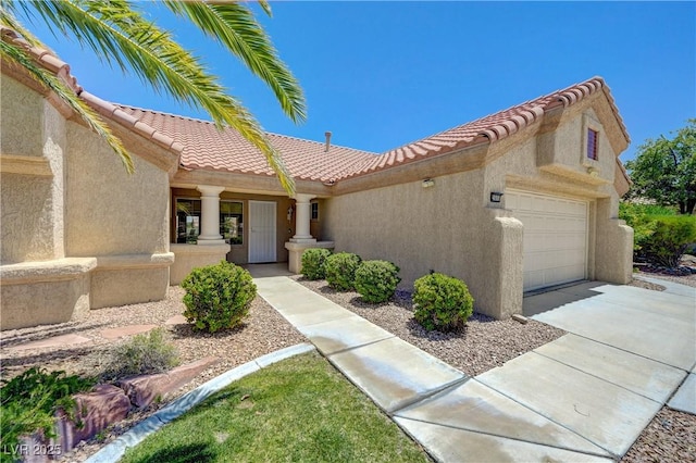 2808 Crown Ridge Dr, Las Vegas, NV 89134 - mediterranean / spanish house featuring stucco siding, a tile roof, a garage, and concrete driveway