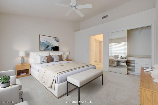 2808 Crown Ridge Dr, Las Vegas, NV 89134 - bedroom with light carpet, a closet, and ceiling fan
