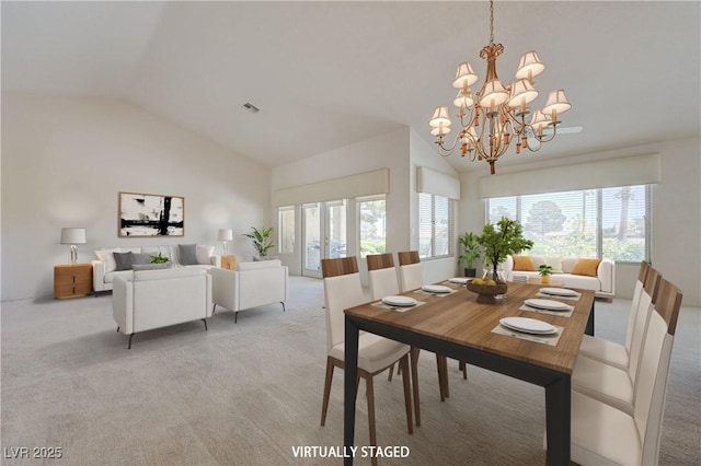2808 Crown Ridge Dr, Las Vegas, NV 89134 - dining area with vaulted ceiling, light colored carpet, and a chandelier