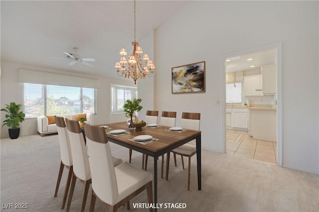 2808 Crown Ridge Dr, Las Vegas, NV 89134 - dining area featuring light carpet, a chandelier, ceiling fan, and lofted ceiling