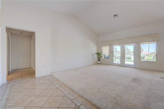 2808 Crown Ridge Dr, Las Vegas, NV 89134 - unfurnished room with light tile patterned flooring, high vaulted ceiling, and inlaid floor details