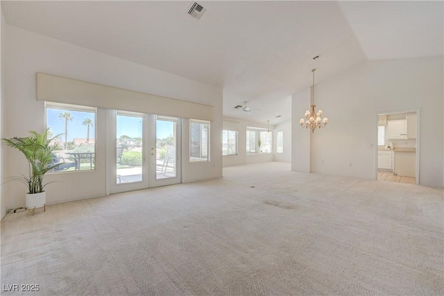 2808 Crown Ridge Dr, Las Vegas, NV 89134 - unfurnished living room with a chandelier, carpet flooring, and high vaulted ceiling