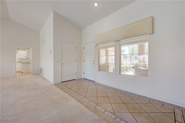 2808 Crown Ridge Dr, Las Vegas, NV 89134 - unfurnished bedroom featuring light tile patterned floors and high vaulted ceiling