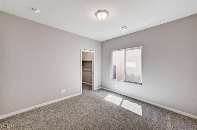 934 Twincrest Ave, North Las Vegas, NV 89032 - unfurnished bedroom featuring carpet flooring, a walk in closet, and a closet
