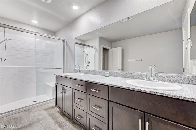 934 Twincrest Ave, North Las Vegas, NV 89032 - bathroom with a shower stall and double vanity