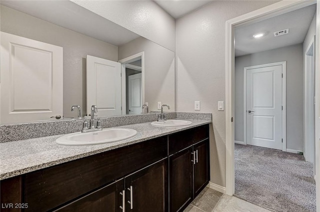 934 Twincrest Ave, North Las Vegas, NV 89032 - bathroom with double vanity and baseboards