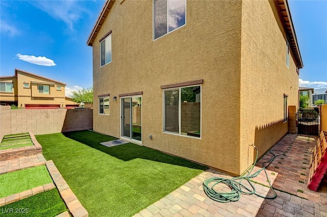 934 Twincrest Ave, North Las Vegas, NV 89032 - back of property with stucco siding and a patio area