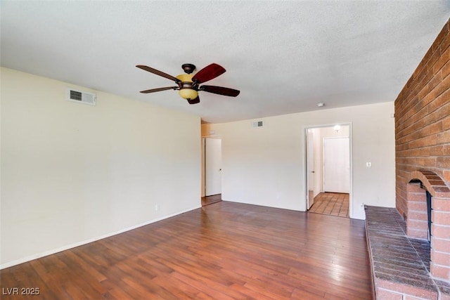 6822 Garden Grove Ave, Las Vegas, NV 89103 - unfurnished living room with wood finished floors, a ceiling fan, and a fireplace