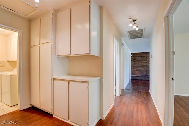6822 Garden Grove Ave, Las Vegas, NV 89103 - hall with hardwood / wood-style floors and washer / dryer