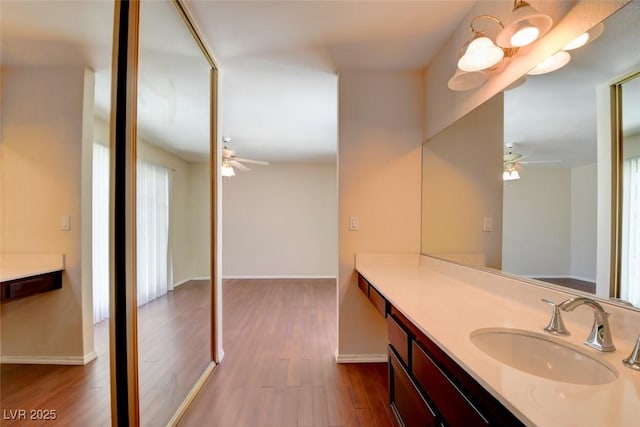 6822 Garden Grove Ave, Las Vegas, NV 89103 - bathroom with a ceiling fan, wood finished floors, and vanity