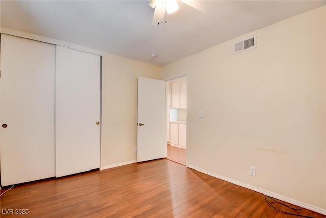 6822 Garden Grove Ave, Las Vegas, NV 89103 - unfurnished bedroom featuring wood finished floors, a closet, and ceiling fan