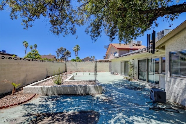 6822 Garden Grove Ave, Las Vegas, NV 89103 - view of swimming pool featuring a patio and a fenced backyard