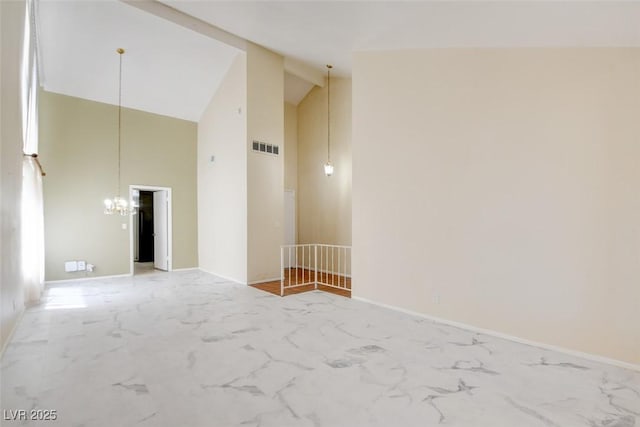 6822 Garden Grove Ave, Las Vegas, NV 89103 - spare room featuring high vaulted ceiling, a chandelier, and light marble finish flooring