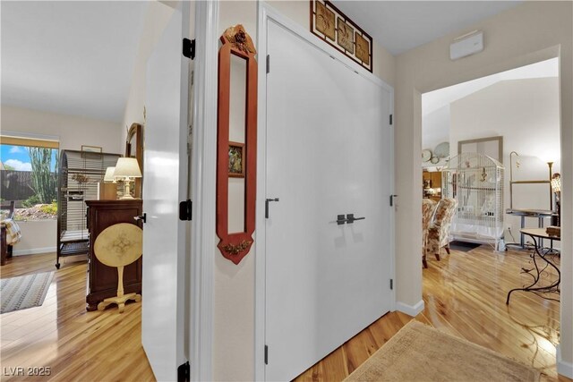 9237 Quail Ridge Dr, Las Vegas, NV 89134 - hallway featuring light wood finished floors